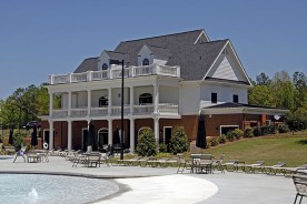 a clubhouse and pool at a country club