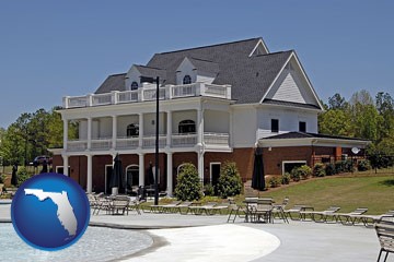a clubhouse and pool at a country club - with Florida icon