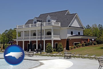 a clubhouse and pool at a country club - with North Carolina icon