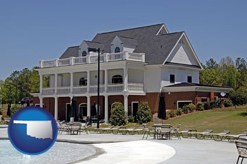 a clubhouse and pool at a country club - with Oklahoma icon